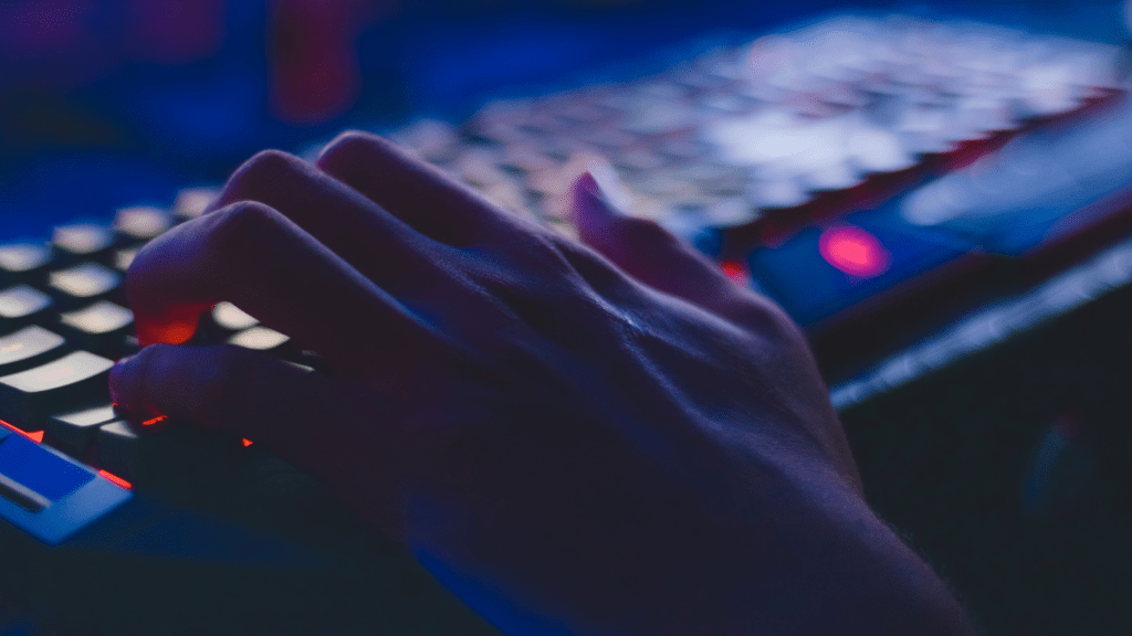 a hand playing a computer game